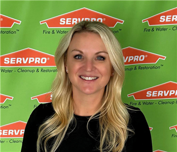 woman in front of servpro backdrop