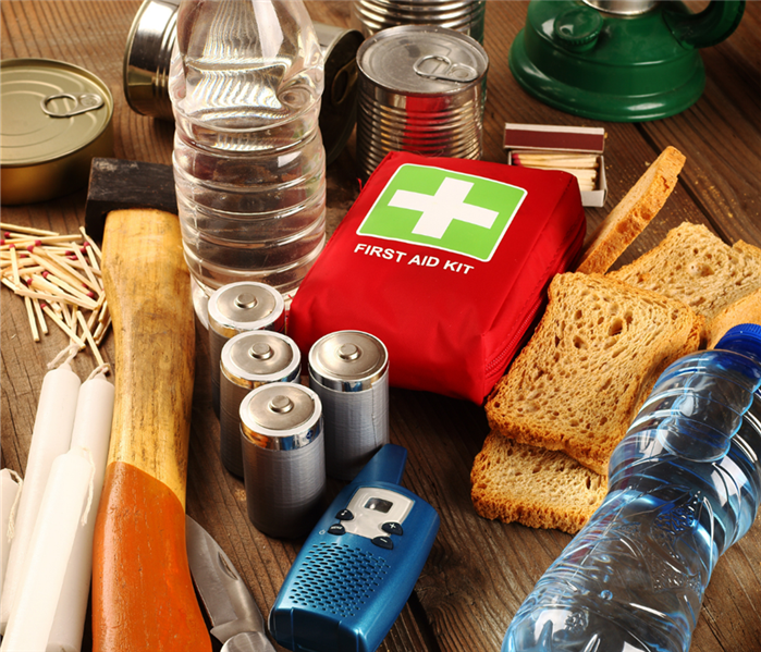 Emergency kit supplies such as first aid kit, food and candles.