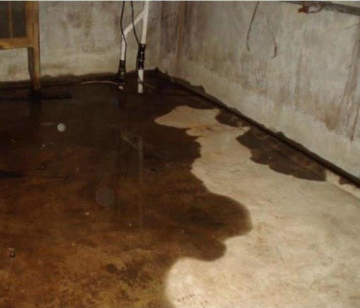Water seeping in through cracks in basement flooring