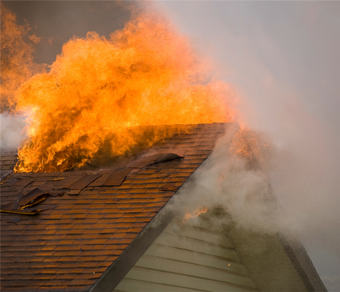 Picture shows a home on fire with a closeup of the roof 
